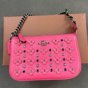 Coach wristlet with flower appliqué
